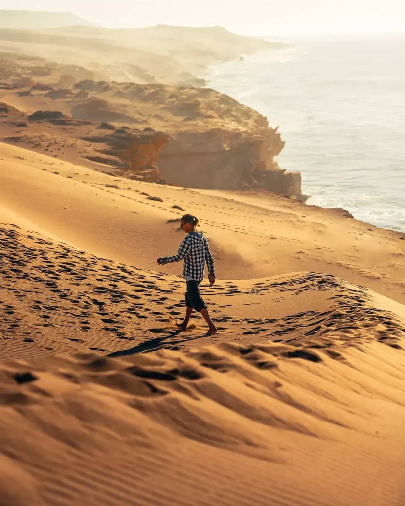 Walking on golden sand at Timlalin Dunes Agadir